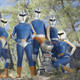 A blue-suited superhero team with a droid.